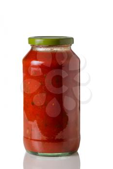 Closeup image of a full unopened glass jar of spaghetti sauce on white with reflection