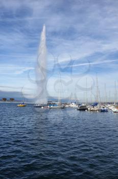Vertical image of Lake Geneva, Switzerland, with famous Jet d’Eau fountain on nice fall day 