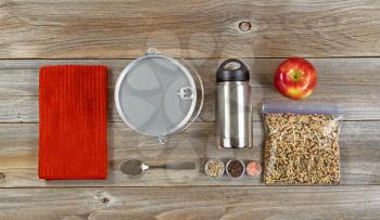 Cooking equipment for Hiking or camping organized on rustic wooden boards. 