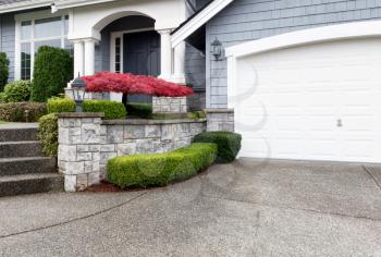 Beautiful home exterior with Autumn color maple tree