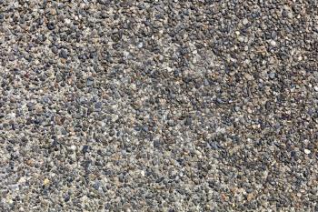 Exposed aggregate concrete background showing beauty of stones  