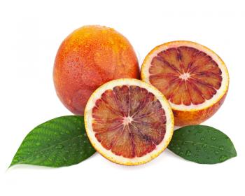 Ripe red blood oranges with cut and green leaves isolated on white background. Closeup.