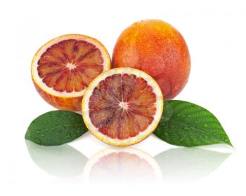 Ripe red blood oranges with cut and green leaves isolated on white background. Closeup.