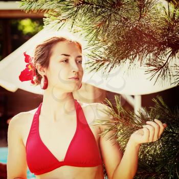 Outdoor fashion portrait of young girl with retro filter effect. Closeup.