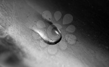 Water Drop on Old Weathered Metal Surface. Balck and White Macro Photo.