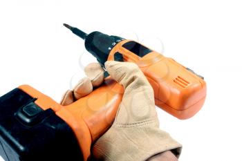 hand with a glove holdind a drill