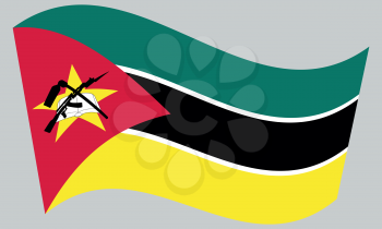 Mozambican national official flag. African patriotic symbol, banner, element, background. Correct colors. Flag of Mozambique waving on gray background, vector