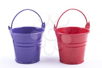 Two iron buckets on white background.