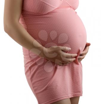 pregnant woman in a pink negligee. isolated with clipping paths