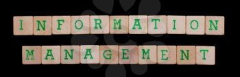 Green letters on old wooden blocks (information management)