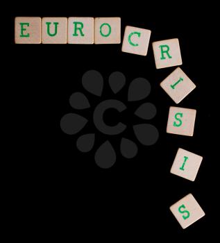 Green letters on old wooden blocks (eurocrisis)