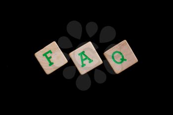 Green letters on old wooden blocks (FAQ)