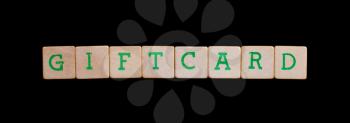 Green letters on old wooden blocks (giftcard)