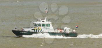 ROTTERDAM, THE NETHERLANDS - JUNE 22: Dutch coast guard (douane, customs) ship on partol in the harbor of Rotterdam, Holland, Rotterdam, June 22, 2012