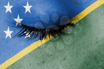 Crying woman, pain and grief concept, flag of The Solomon Islands