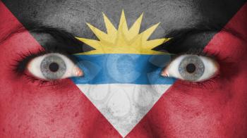 Close up of eyes. Painted face with flag of Antigua and Barbuda