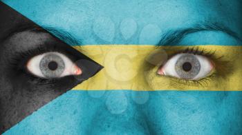 Close up of eyes. Painted face with flag of Bahamas