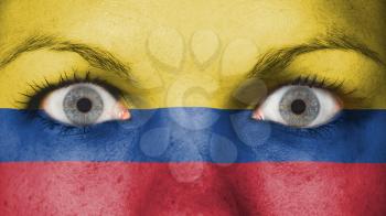 Close up of eyes. Painted face with flag of Colombia