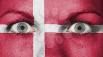 Close up of eyes. Painted face with flag of Denmark