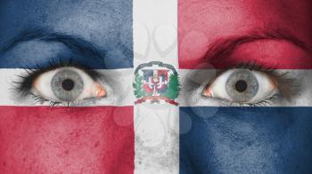 Close up of eyes. Painted face with flag of Dominican Republic