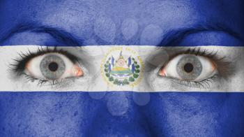 Close up of eyes. Painted face with flag of El Salvador