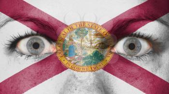 Close up of eyes. Painted face with flag of Florida