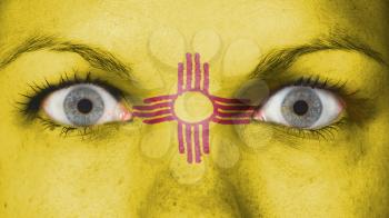 Close up of eyes. Painted face with flag of New Mexico