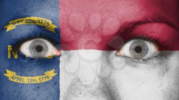 Close up of eyes. Painted face with flag North Carolina