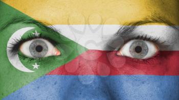 Close up of eyes. Painted face with flag of The Comoros