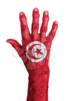 Hand of an old woman wrapped in flag of Tunisia