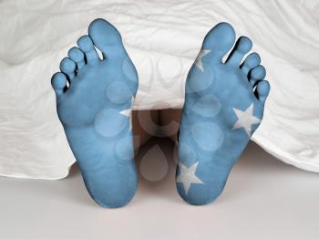 Feet with flag, sleeping or death concept, flag of Micronesia