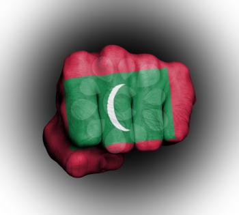 Fist of a man punching, flag of Maldives