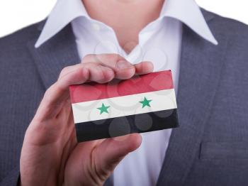 Businessman showing card, matte paper effect, Syria