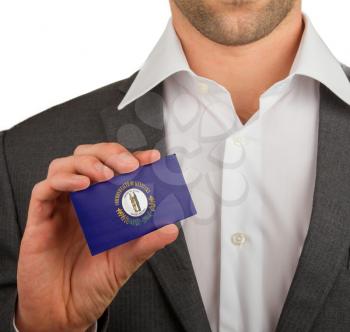 Businessman is holding a business card, flag of Kentucky
