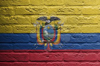 Brick wall with a painting of a flag isolated, Ecuador