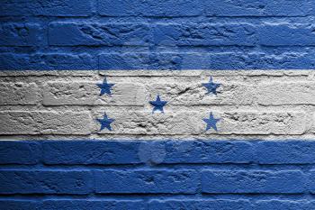 Brick wall with a painting of a flag isolated, Honduras