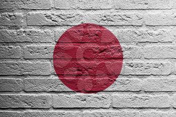 Brick wall with a painting of a flag isolated, Japan