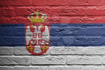 Brick wall with a painting of a flag isolated, Serbia