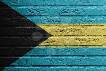 Brick wall with a painting of a flag isolated, The Bahamas