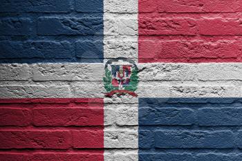 Brick wall with a painting of a flag isolated, the dominican republic