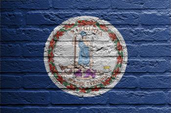 Brick wall with a painting of a flag isolated, Virginia