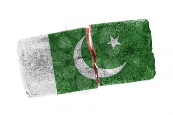 Rough broken brick, isolated on white background, flag of Pakistan