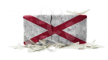 Brick with broken glass, violence concept, flag of Alabama