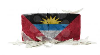 Brick with broken glass, violence concept, flag of Antigua and Barbuda
