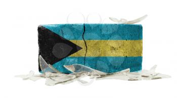 Brick with broken glass, violence concept, flag of Bahamas