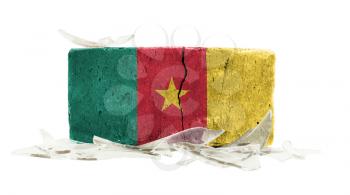 Brick with broken glass, violence concept, flag of Cameroon