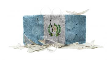 Brick with broken glass, violence concept, flag of Guatemala