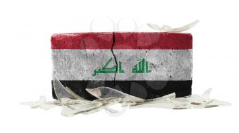 Brick with broken glass, violence concept, flag of Iraq