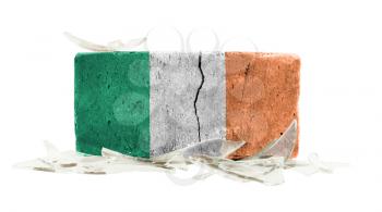 Brick with broken glass, violence concept, flag of Ireland