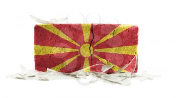 Brick with broken glass, violence concept, flag of Macedonia